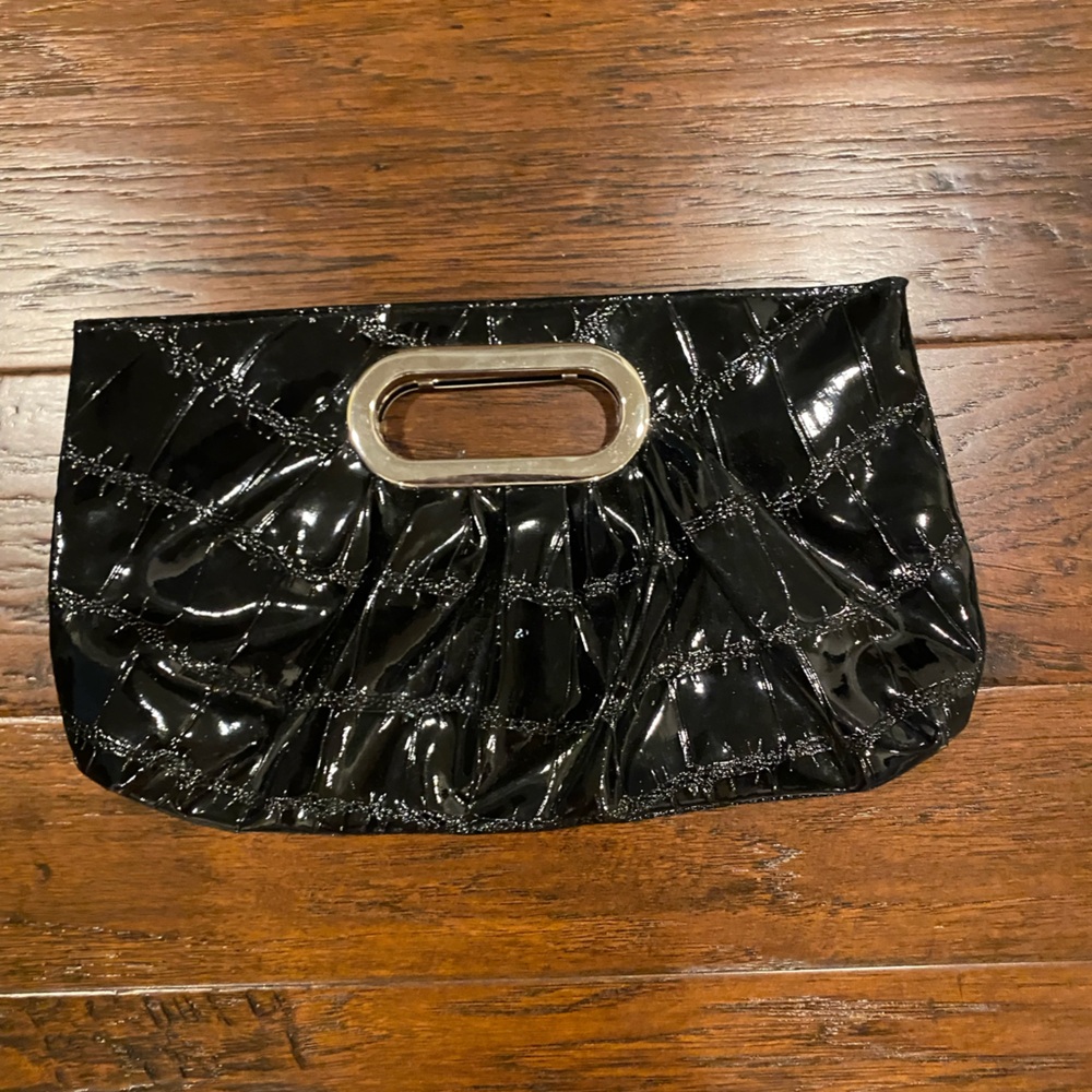 Claire’s crocodile print black clutch